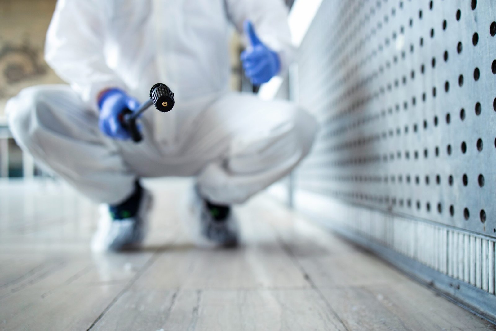 person-white-chemical-protection-suit-doing-disinfection-public-areas-stop-spreading-highly-contagious-corona-virus