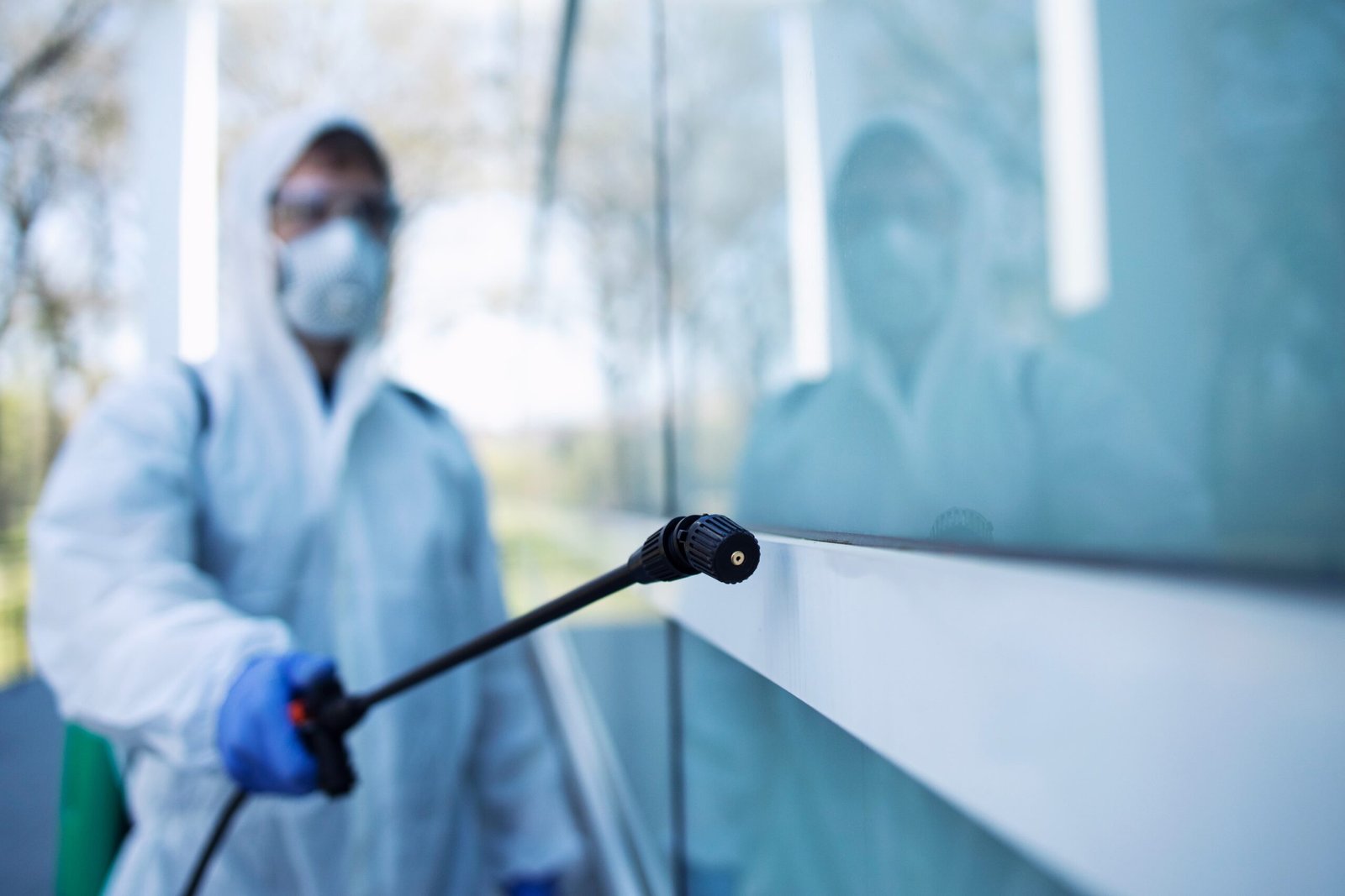 shot-male-person-white-chemical-protection-suit-doing-disinfection-public-areas-stop-spreading-highly-contagious-corona-virus shot-male-person-white-chemical-protection-suit-doing-disinfection-public-areas-stop-spreading-highly-contagious-corona-virus
